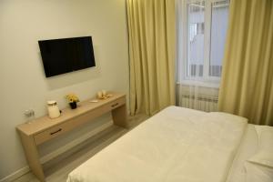 Postel nebo postele na pokoji v ubytování QUT Hotel
