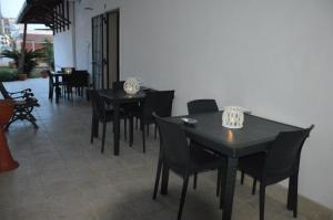 a dining room with black tables and chairs at Depan Dance in Gallipoli