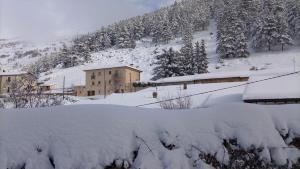 a pile of snow on top of a building at Casa Pie' di Monte Refuge in Bisegna