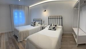 Ein Bett oder Betten in einem Zimmer der Unterkunft Cantábrico Fonsagrada