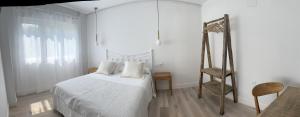 Ein Bett oder Betten in einem Zimmer der Unterkunft Cantábrico Fonsagrada