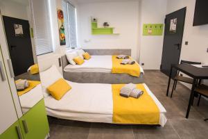 Una cama o camas en una habitación de DORM BG pet-friendly Aparthotel