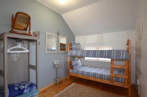 a room with two bunk beds in a house at Paradise Nook in Yzerfontein +7 photos