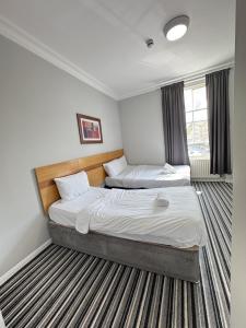 Postel nebo postele na pokoji v ubytování The Chapter Hotels - Princes Square