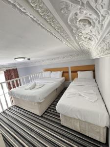 Postel nebo postele na pokoji v ubytování The Chapter Hotels - Princes Square