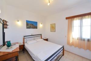 Postel nebo postele na pokoji v ubytování Windmill Villas