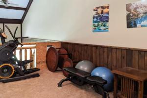 a room with a gym equipment and a stair railing at Southern Comfort Cabin By Avada Properties in Gatlinburg