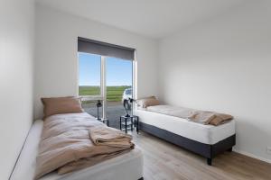 Voodi või voodid majutusasutuse 3BR Modern & Spacious Golden Circle Home toas