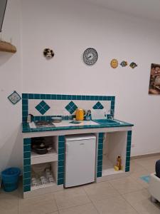 Kuchyňa alebo kuchynka v ubytovaní ortigia adriana suite