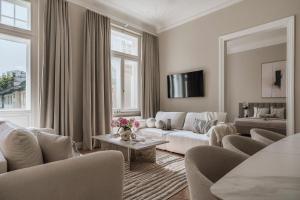 a living room with a couch and a table at La Belle Epoque - LoftAffair Collection in Warsaw +264 photos