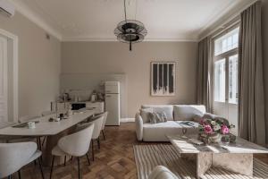 a living room with a couch and a table at La Belle Epoque in Warsaw