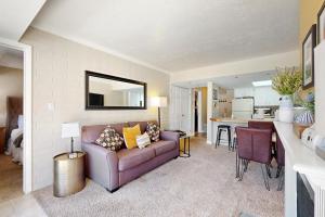 a living room with a couch and a kitchen at New Claim Condominiums 114 in Park City