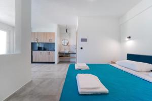 Ένα ή περισσότερα κρεβάτια σε δωμάτιο στο Sunset Apartments