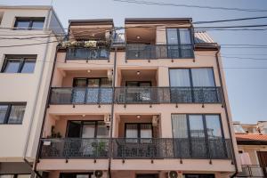 an apartment building with balconies and windows at Luxury Apartments Stefano - Prestige in Ohrid