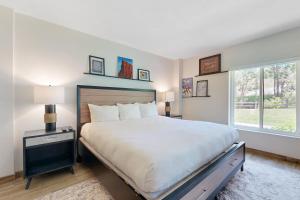 a bedroom with a large bed and a window at Park Station Elegance 210 in Park City