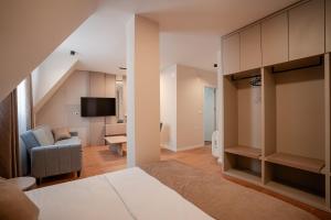 a bedroom with a bed and a living room at Luxury Apartments Stefano - Prestige in Ohrid