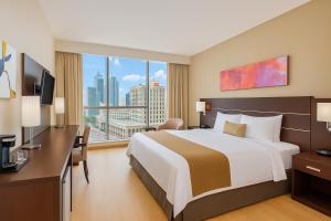 En eller flere senger på et rom på Tryp by Wyndham Panama Centro