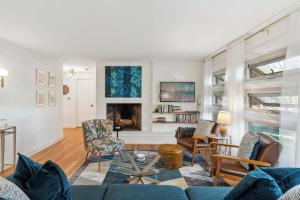 a living room with a blue couch and chairs at Washington's Rye House AC Bikes New Kitchen in Rye