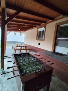 a game room with a foos ball on a table at Hattyú vendégház Poroszló in Poroszló