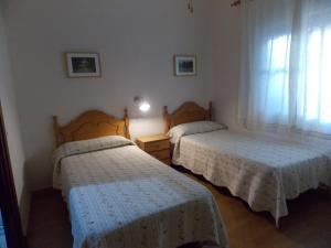 Postel nebo postele na pokoji v ubytování Pensión La Palma