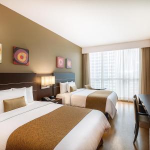 En eller flere senger på et rom på Tryp by Wyndham Panama Centro