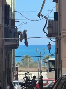 a group of people walking down a street at Matis home in Barletta