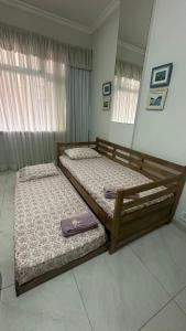 Кровать или кровати в номере Aconchegante Beira-Mar Copacabana Passos da Praia