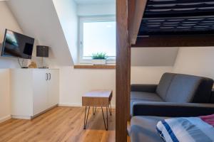 Una televisión o centro de entretenimiento en Strandhaus Grömitz 2a