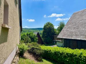 a view from the side of a house at L'Aubrac au fil des saisons in Prades-dʼAubrac