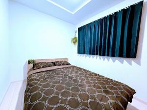 Excel 平岸 -FIX HOME- tesisinde bir odada yatak veya yataklar
