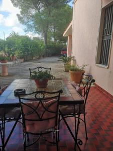 a table and chairs sitting on a patio at Villa Luisa in Carovigno