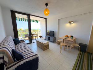 a living room with a couch and a table at Acapulco Beach in Costa de Adeje