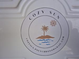 Ein Zertifikat, Auszeichnung, Logo oder anderes Dokument, das in der Unterkunft Cozy Sun ausgestellt ist