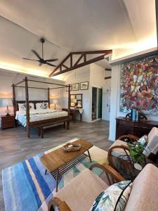 a large living room with a bed and a couch at Sinurambi Cottage Rental in Penampang +136 photos