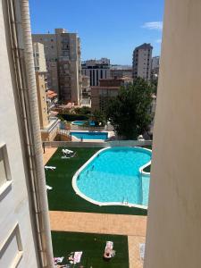 a view of a swimming pool from a building at Precioso estudio completo en 1º linea in Puerto de Gandía