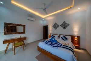Postel nebo postele na pokoji v ubytování Radiance Ocean View Private Villas Lembongan