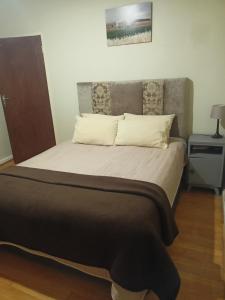 Ένα ή περισσότερα κρεβάτια σε δωμάτιο στο Mooi Uitsig Droom