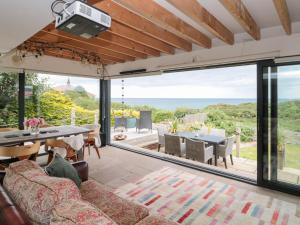 a living room with a couch and a table at Sea Haven in Filey