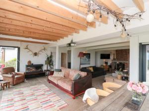 a living room with a couch and a table at Sea Haven in Filey