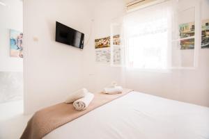 Letto o letti in una camera di Hotel Delfines