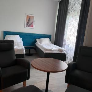 Postel nebo postele na pokoji v ubytování Hotelli Kainuunportti