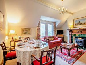 a living room with a table and a fireplace at 2 Bed in Threlkeld SZ135 in Threlkeld