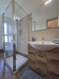 Ένα μπάνιο στο Appartamento Morelli Beach - Via Lago di Misurina