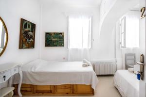Letto o letti in una camera di Hotel Delfines