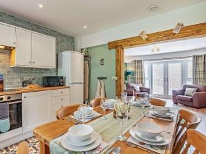 a kitchen and dining room with a table and chairs at 3 Bed in Hamsterley 89896 in Witton le Wear