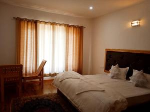 Postel nebo postele na pokoji v ubytování Suku Villa