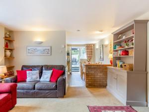 a living room with a couch and a table at 3 Bed in Saint Austell 95623 in Gorran Haven