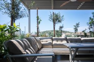 a living room with a couch and a table at September15 Suites- Meganisi in Meganisi