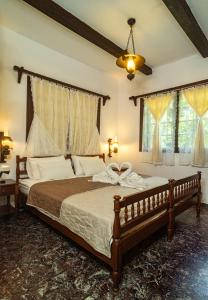 Postel nebo postele na pokoji v ubytování Guesthouse To kalivi
