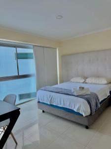 Ένα ή περισσότερα κρεβάτια σε δωμάτιο στο Suite con espectacular vista al rio Guayas